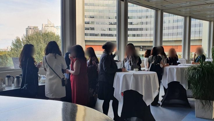 guests and speakers connected with coffee/tea in the coffee area after the event